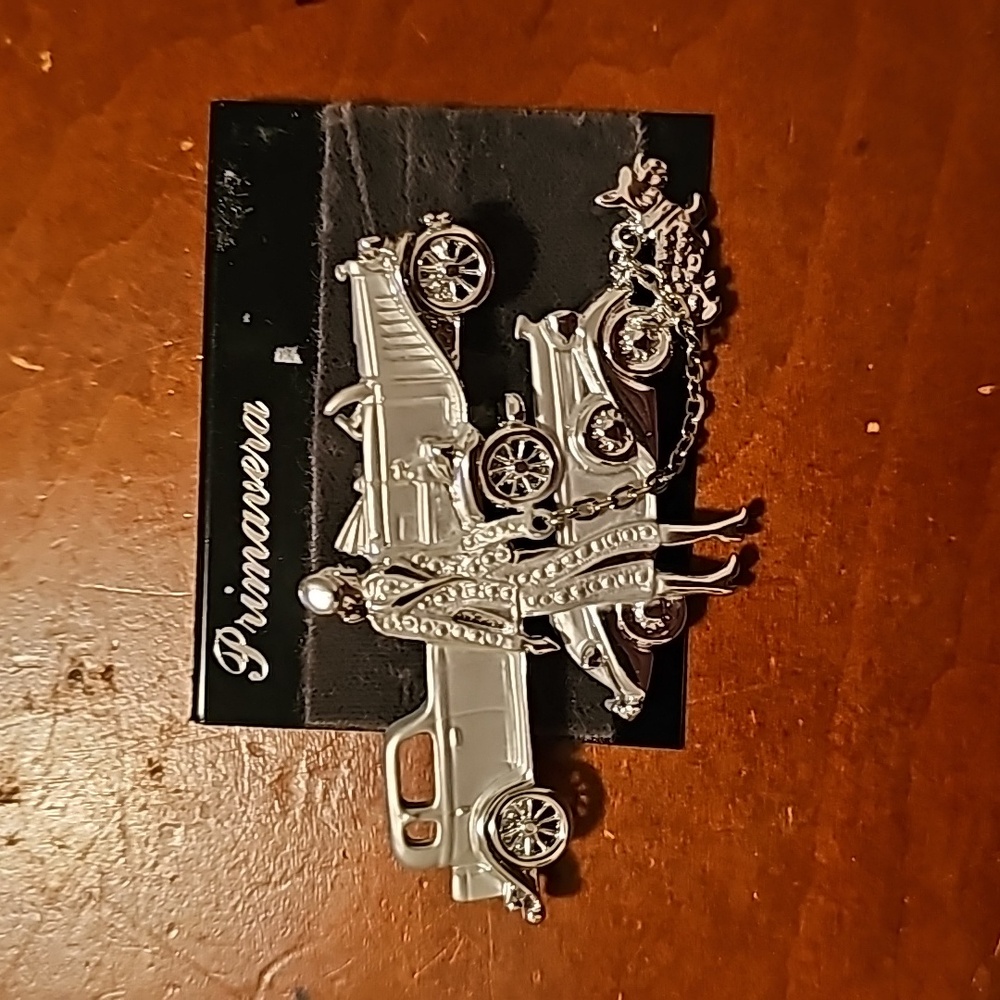 Primavera pin, woman, her roles royce and Yorkie
